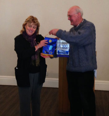 Indianapolis Rotarian Betty Tonsing Exchanges Banner with South Africa
